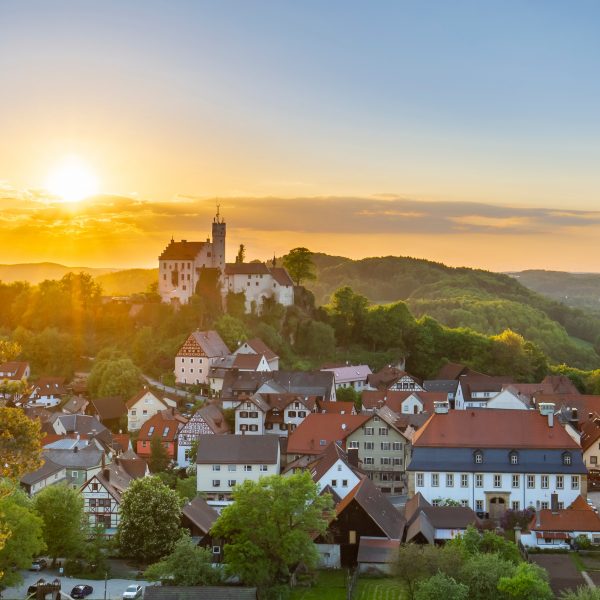 a city with a castle on top of it