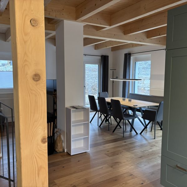 a room with a table and chairs