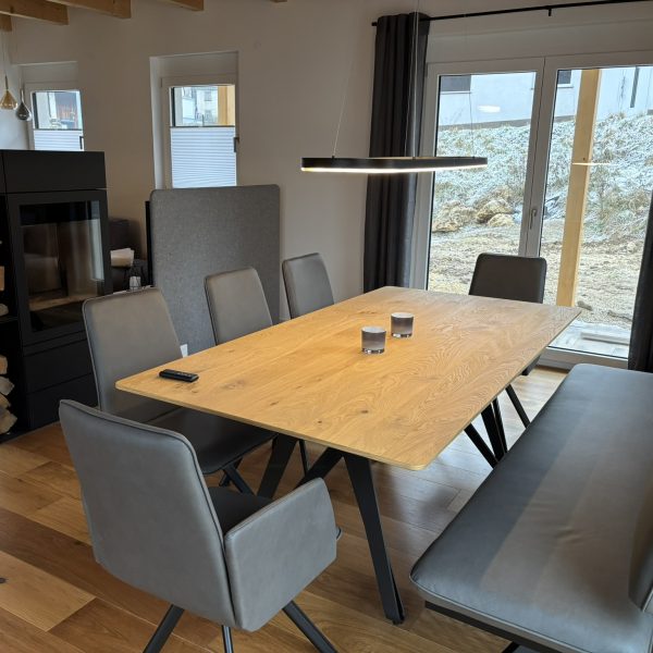 a table with chairs in a room