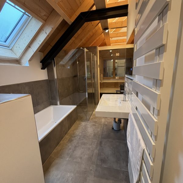 a bathroom with a shower and tub