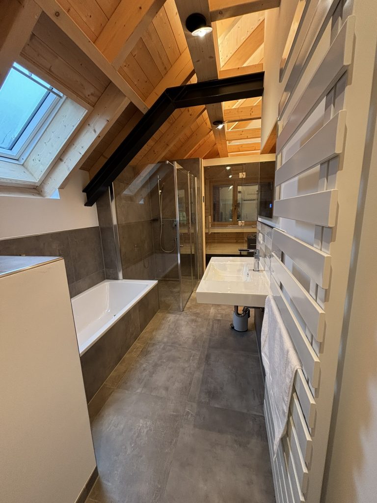a bathroom with a shower and tub