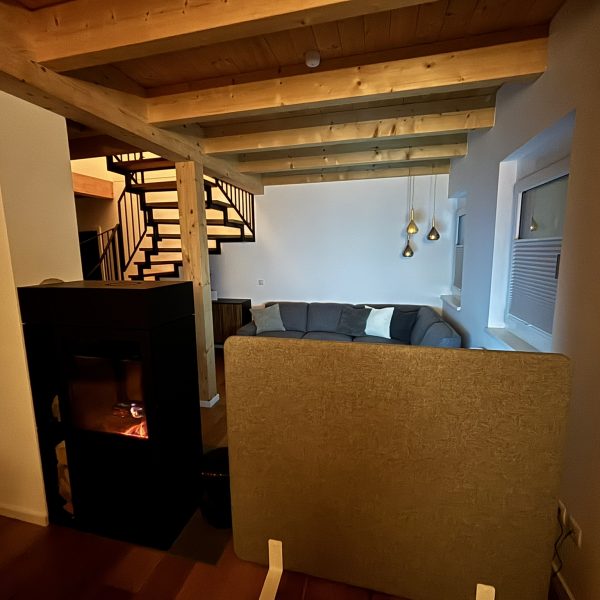 a room with a couch and fireplace
